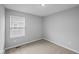 Cozy bedroom featuring carpeted floors and natural light from window at 1709 Real St, Indianapolis, IN 46240