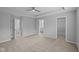 Spacious bedroom with a tray ceiling, neutral carpet, and multiple closets at 1709 Real St, Indianapolis, IN 46240