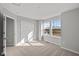 Bedroom featuring wall-to-wall carpeting, a double-door closet, and a bright window at 1709 Real St, Indianapolis, IN 46240