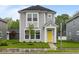 Charming two-story home with a bright yellow front door and well-manicured lawn at 1709 Real St, Indianapolis, IN 46240