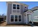 Charming two-story home with gray siding, white trim, and a welcoming front entrance at 1709 Real St, Indianapolis, IN 46240