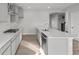 Modern kitchen with stainless steel appliances, granite countertops, and a spacious island at 1709 Real St, Indianapolis, IN 46240