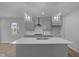 Modern kitchen with stainless steel appliances, quartz countertops, and an island at 1709 Real St, Indianapolis, IN 46240