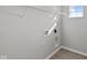 A utility sink and wire shelving above the washer and dryer hookups make this laundry room functional at 1709 Real St, Indianapolis, IN 46240