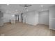 Spacious living room area featuring a ceiling fan and luxury vinyl plank flooring at 1709 Real St, Indianapolis, IN 46240