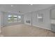 Spacious living room featuring a modern fireplace, recessed lighting and luxury vinyl plank flooring at 1709 Real St, Indianapolis, IN 46240