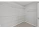 Walk-in closet with wire shelving and carpeting at 1709 Real St, Indianapolis, IN 46240