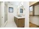 Modern bathroom with a double vanity, walk-in shower, and neutral tile at 1822 Central Ave, Indianapolis, IN 46202