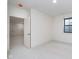 Bedroom with neutral carpet, recessed lighting, and a window for natural light at 1822 Central Ave, Indianapolis, IN 46202