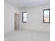 Spacious bedroom with carpet, white walls, and new window at 1822 Central Ave, Indianapolis, IN 46202
