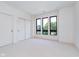 Bright bedroom with carpet, large windows, and double closets at 1822 Central Ave, Indianapolis, IN 46202