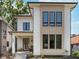 Modern two-story home with a welcoming front porch and beautiful landscaping at 1822 Central Ave, Indianapolis, IN 46202