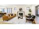 Open living space with fireplace, comfortable seating, and seamless flow to the dining area at 1822 Central Ave, Indianapolis, IN 46202