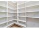 Walk-in pantry featuring custom shelving, providing ample storage space at 1822 Central Ave, Indianapolis, IN 46202