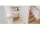 Staircase with white walls, wooden stairs, neutral carpet and window with natural light at 1822 Central Ave, Indianapolis, IN 46202
