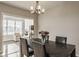 Bright dining area with modern lighting fixtures and natural light, creating a warm atmosphere at 19629 Astoria Ave, Sheridan, IN 46069