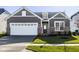 Charming home featuring a two-car garage, stone accents, and a well-manicured lawn at 19629 Astoria Ave, Sheridan, IN 46069