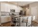 Modern kitchen featuring white cabinets, granite countertops, and stainless steel appliances at 19629 Astoria Ave, Sheridan, IN 46069