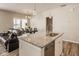 Modern kitchen with granite countertops, island, and stainless steel appliances at 19629 Astoria Ave, Sheridan, IN 46069