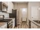 Modern kitchen with white cabinets, granite countertops and stainless steel appliances at 19629 Astoria Ave, Sheridan, IN 46069