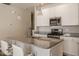 Modern kitchen with white cabinets, granite countertops and stainless steel appliances at 19629 Astoria Ave, Sheridan, IN 46069