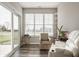 Relaxing sunroom featuring a cozy chair, sliding door and large windows for natural light and backyard views at 19629 Astoria Ave, Sheridan, IN 46069