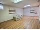 Finished basement with laminate flooring and shelving at 2062 Sumpter Trl, Columbus, IN 47203