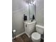 Small bathroom with white vanity and dark floor at 2062 Sumpter Trl, Columbus, IN 47203