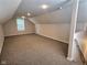 Spacious bonus room with carpet, window, and recessed lights at 2062 Sumpter Trl, Columbus, IN 47203