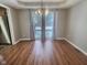 Dining room with hardwood floors, gray walls, and sliding glass doors at 2062 Sumpter Trl, Columbus, IN 47203