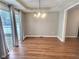 Dining room with hardwood floors and sliding glass doors at 2062 Sumpter Trl, Columbus, IN 47203