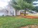 Two-story house with a large tree in the front yard at 2062 Sumpter Trl, Columbus, IN 47203