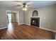 Living room with hardwood floors, fireplace, and ceiling fan at 2062 Sumpter Trl, Columbus, IN 47203