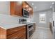 Modern kitchen with stainless steel appliances and wood cabinets at 2480 E 99Th St, Carmel, IN 46280