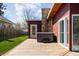Spacious backyard with a wooden deck, hot tub, and exterior door to the house at 2894 W Grove Dr, Greenfield, IN 46140