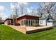 Expansive backyard featuring a large wooden deck with a hot tub and stylish outdoor seating at 2894 W Grove Dr, Greenfield, IN 46140