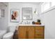 Stylish bathroom with a wood vanity, modern fixtures, and a shower over tub at 2894 W Grove Dr, Greenfield, IN 46140