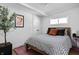 Cozy bedroom with a striped bedspread, natural light, and a complementary color scheme at 2894 W Grove Dr, Greenfield, IN 46140