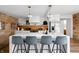 Well-lit kitchen featuring a white island with seating, modern appliances, and stylish decor at 2894 W Grove Dr, Greenfield, IN 46140