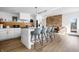 Modern kitchen with a white island, bar stool seating, and stainless steel appliances at 2894 W Grove Dr, Greenfield, IN 46140