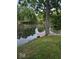 Serene lakefront view with private dock and lush greenery at 2894 W Grove Dr, Greenfield, IN 46140