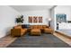 Spacious living room featuring a large leather sectional sofa, rug, and modern decor at 2894 W Grove Dr, Greenfield, IN 46140