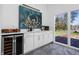 Convenient wet bar area with wine fridge and easy access to the outdoor deck at 2894 W Grove Dr, Greenfield, IN 46140