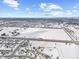 Aerial view of neighborhood with large snowy field at 300 Winterset Way, Greenwood, IN 46143