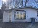 Side view of the house with a bay window and white lattice at 3178 Normandy Rd, Indianapolis, IN 46222