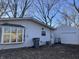 House exterior with a bay window, attached garage, and driveway at 3178 Normandy Rd, Indianapolis, IN 46222