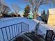 Fenced backyard with shed and snowy landscape at 325 S Market St, Thorntown, IN 46071