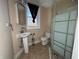Updated bathroom with pedestal sink, toilet, and walk-in shower at 325 S Market St, Thorntown, IN 46071