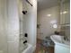 Clean bathroom with a white vanity and tub/shower combo at 325 S Market St, Thorntown, IN 46071