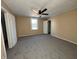 Spacious bedroom with ceiling fan and neutral carpeting at 325 S Market St, Thorntown, IN 46071